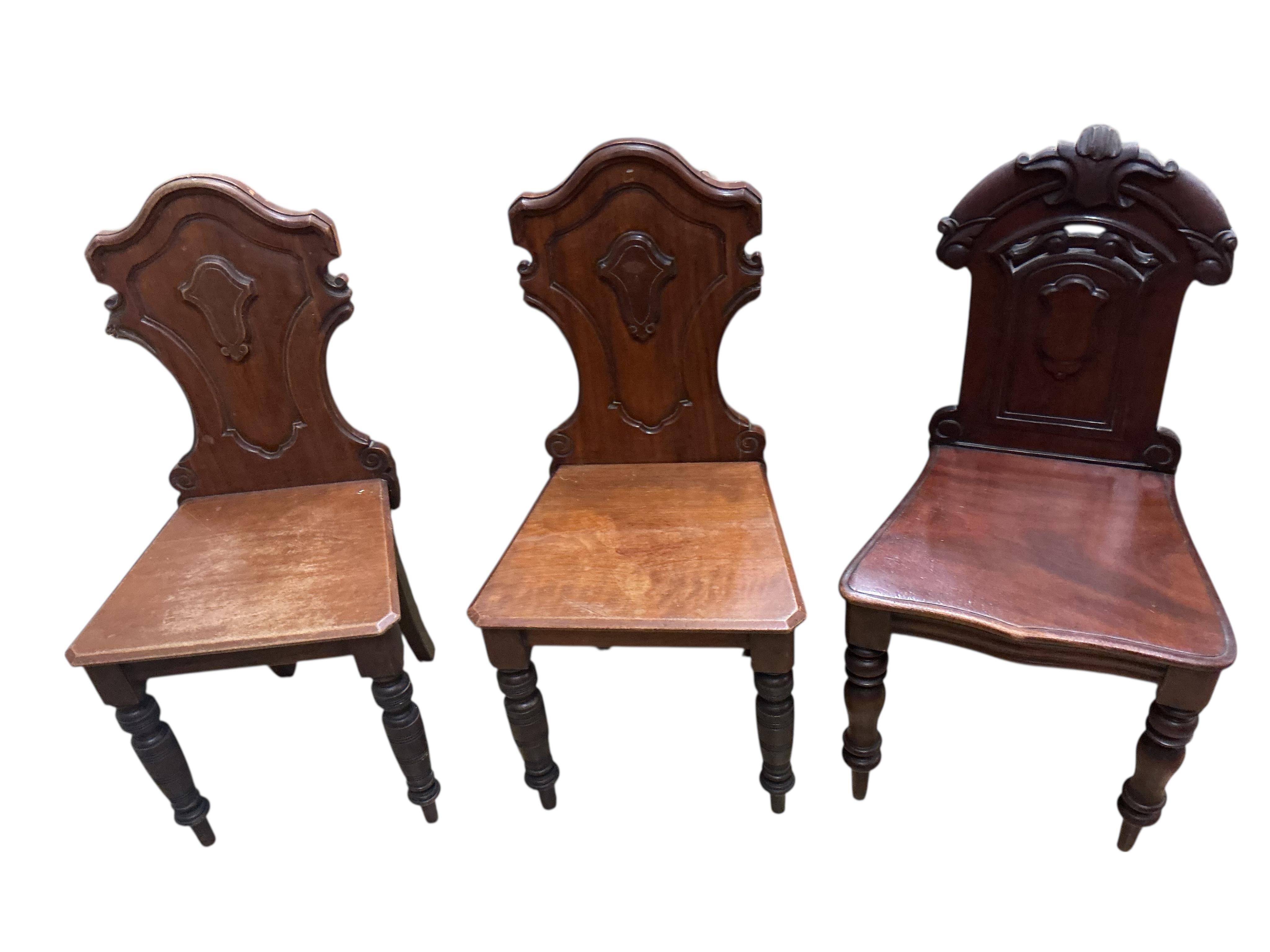 Three (two plus one) Victorian mahogany hall chairs, larger width 43cm, height 90cm